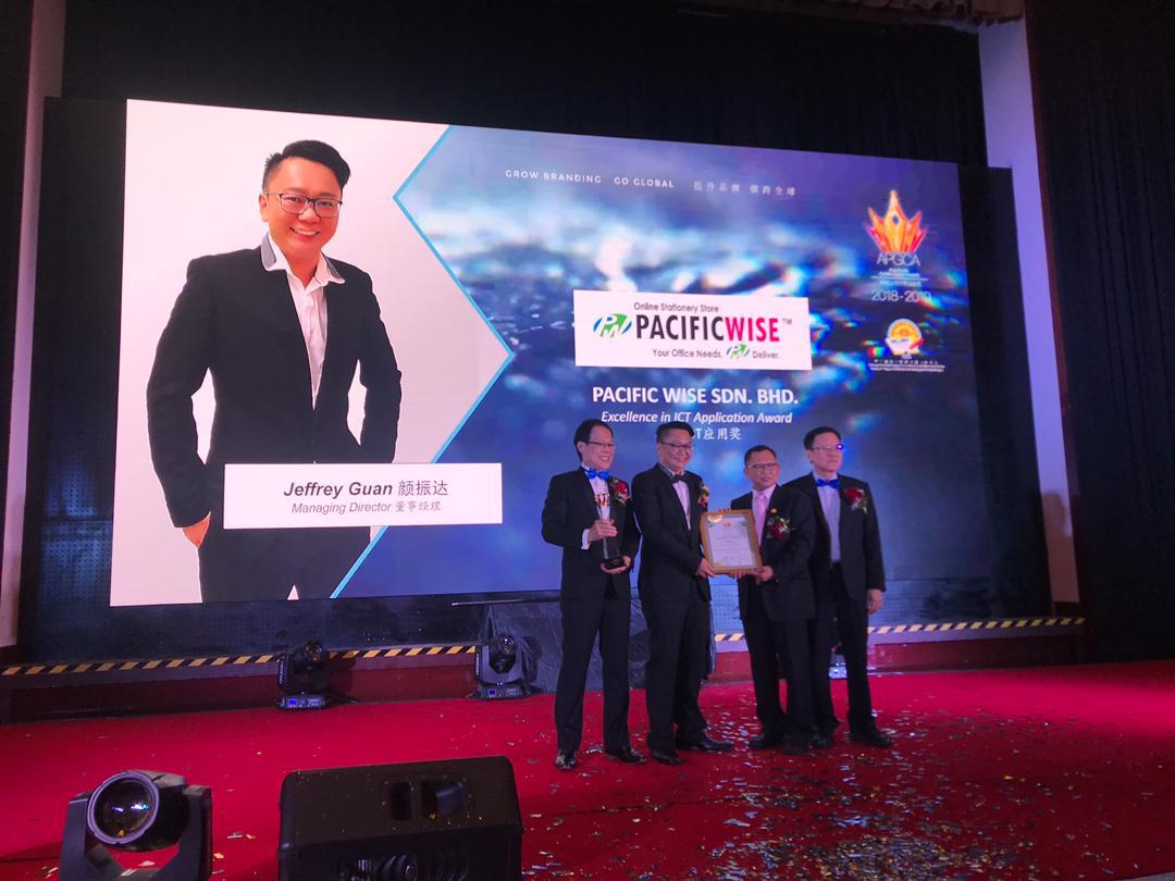 Pacific Wise receiving the Excellence in ICT Application Award on stage at APGCA 2018–2019
